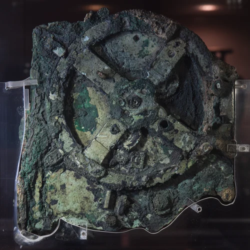 The largest corroded bronze fragment of the Antikythera mechanism, showing gear wheels