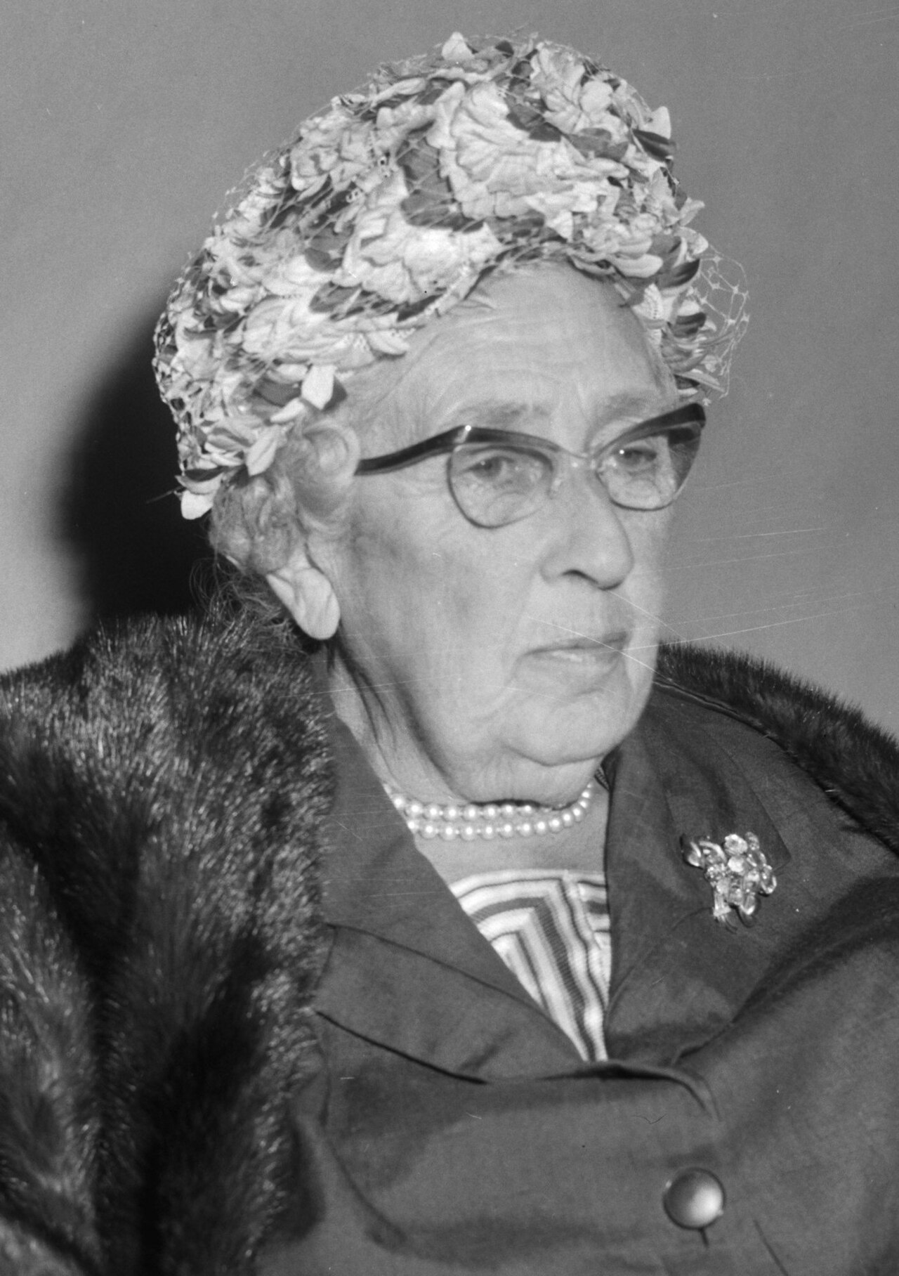 Agatha Christie in later life, wearing a hat and coat